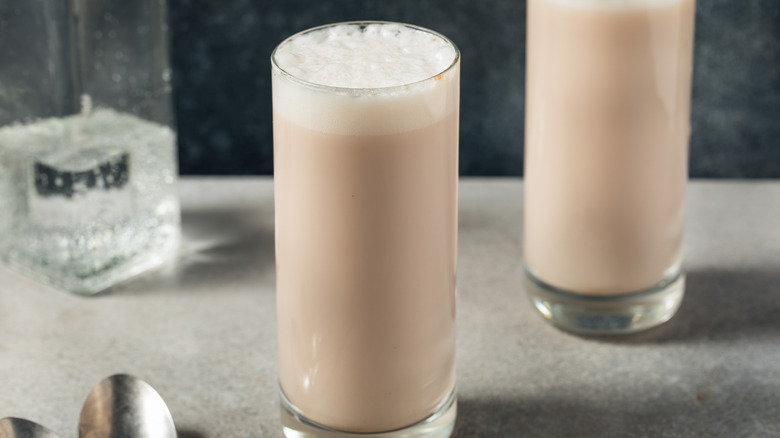 two glasses of egg soda on a granite counter